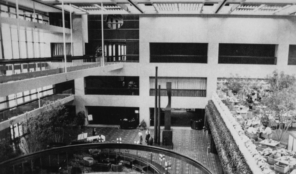This image shows the lobby of the newly constructed Hyatt Regency Hotel in 1980. The two skywalks near the window on the left were the ones that collapsed on July 17 1981. Investigations into what caused the collapse determined that the design for the rods that suspended the skywalks from the ceiling had been altered from the original plan which ultimately pushed the suspension system beyond its capacity. The design flaw was missed through a series of oversights by designers and builders. The collapse has become a case study for engineering safety.