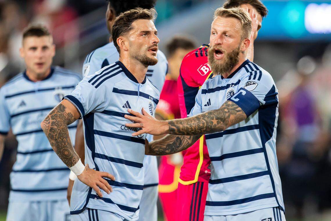 Sporting Kansas City forward Johnny Russell, right, attempts to calm teammate Tim Liebold after a called penalty during Saturday night’s inaugural match between Sporting KC and St. Louis City SC at CITYPARK in St. Louis.