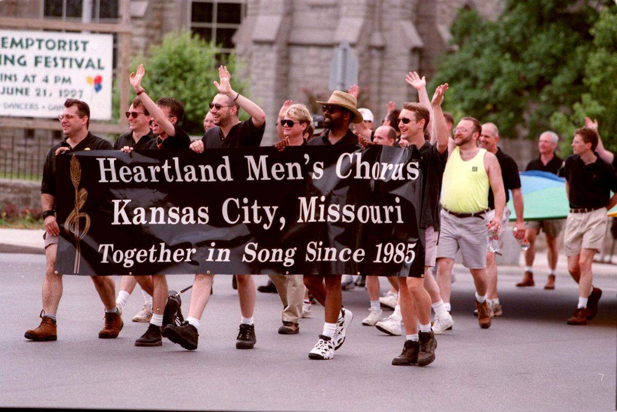 Members of the Heartland Men’s Chorus march in the 1997 Gay and Lesbian Pride Celebration Parade from Westport to 31st Street and Broadway in Kansas City.
