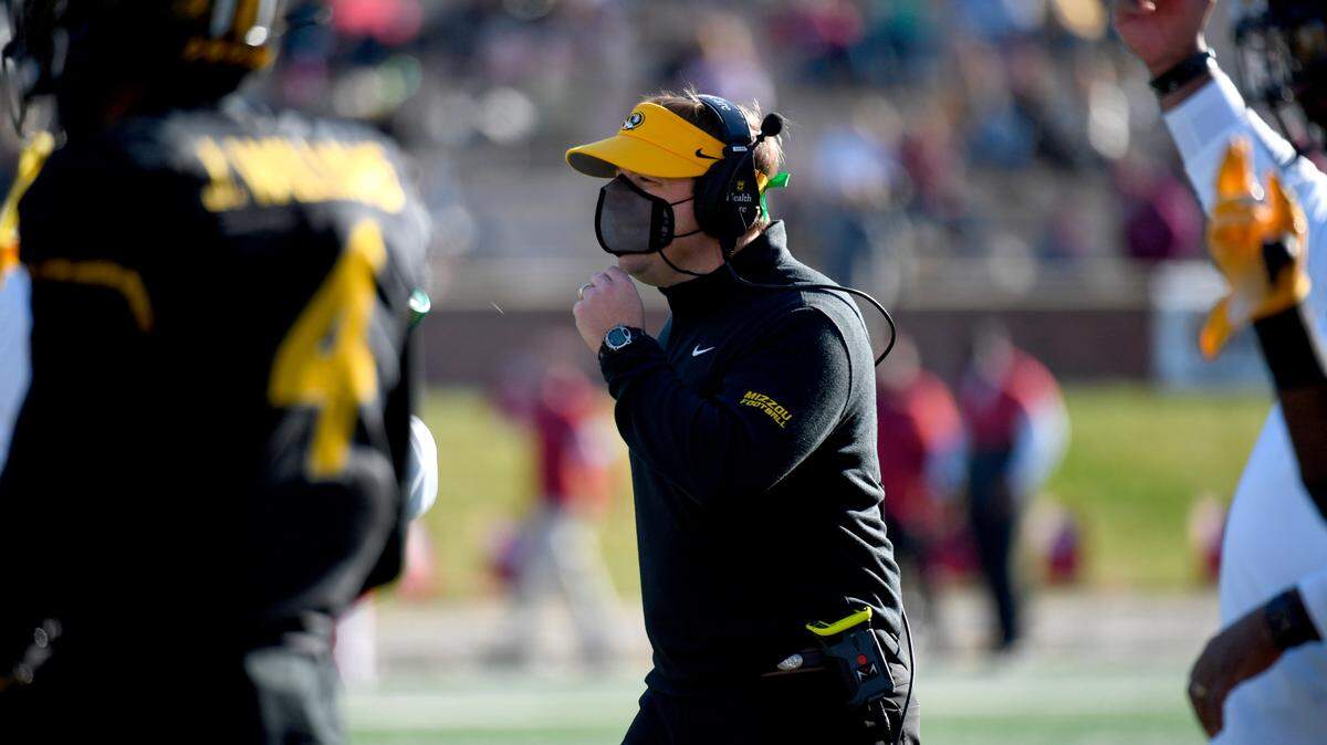 Missouri head coach Eliah Drinkwitz watches from the sidelines during the second half of an NCAA college football game against Arkansas Saturday, Dec. 5, 2020, in Columbia, Mo. (AP Photo/L.G. Patterson)