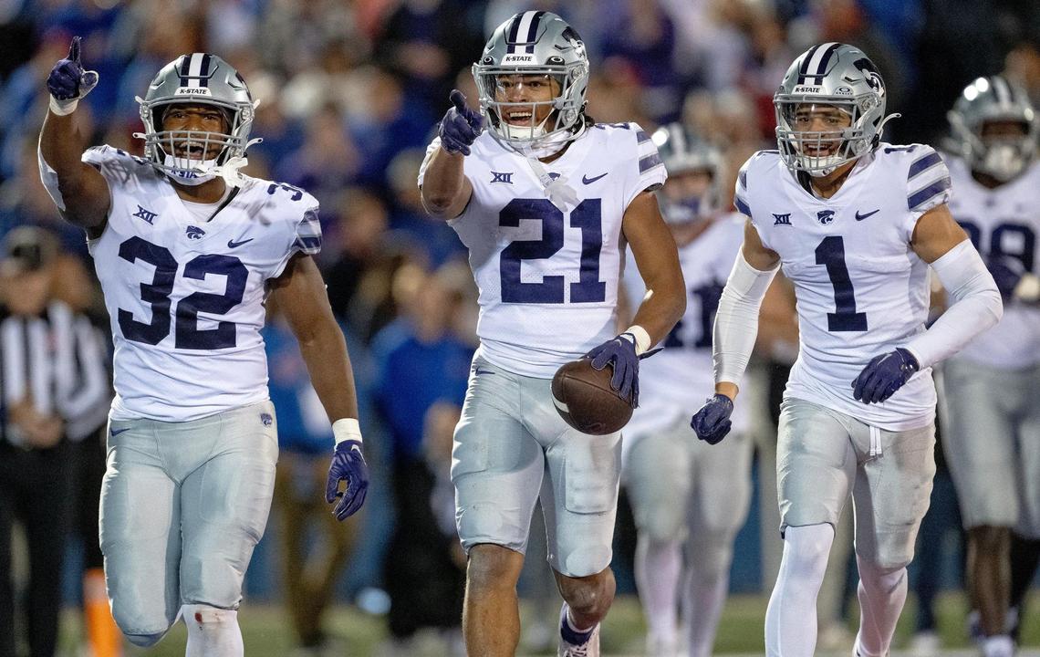 Kansas State Wildcats safety Marques Sigle (21) celebrates an interception during an NCAA college football game against the Kansas Jayhawks on Saturday, Nov. 18, 2023, in Lawrence, Kan.
