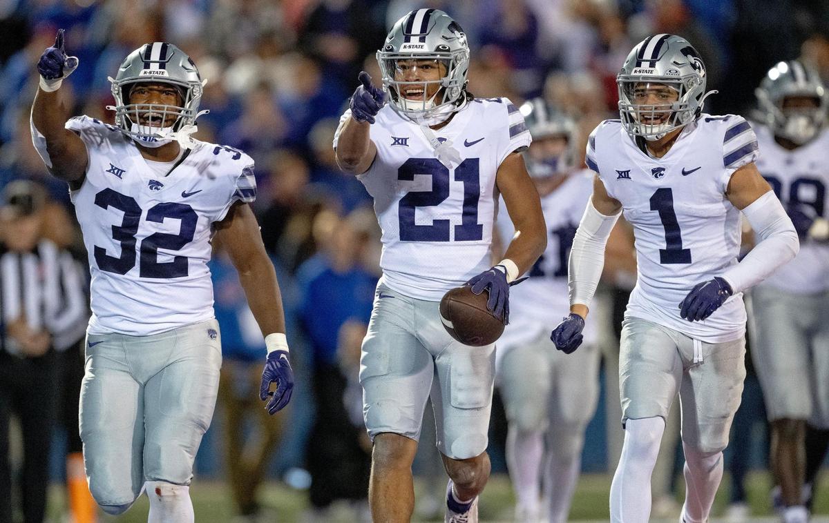 Kansas State Wildcats safety Marques Sigle (21) celebrates an interception during an NCAA college football game against the Kansas Jayhawks on Saturday, Nov. 18, 2023, in Lawrence, Kan.