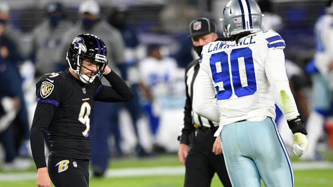 Baltimore Ravens kicker Justin Tucker (9) reacts after missing a field goal against the Dallas Cowboys during the first half of an NFL football game, Tuesday, Dec. 8, 2020, in Baltimore. (AP Photo/Nick Wass)