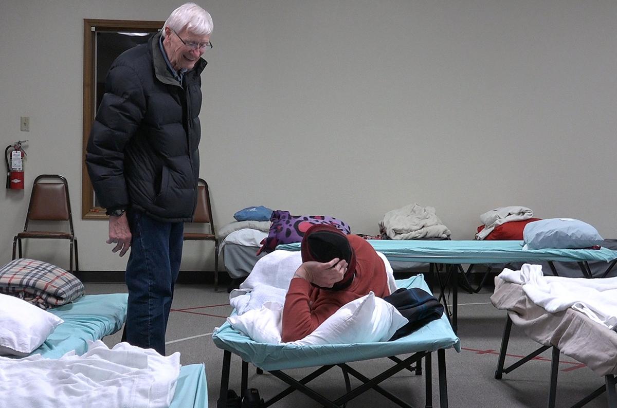 Dean Askeland, co-founder of Project 1020, talks with a client who was staying at the shelter.