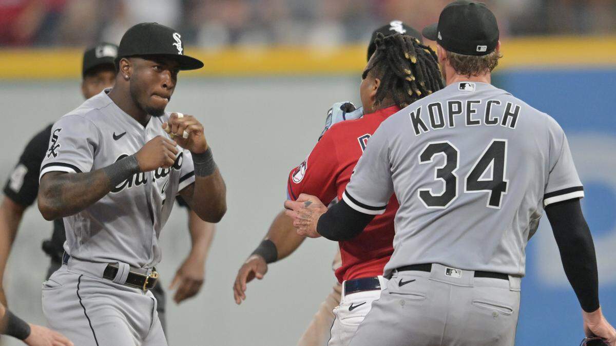 Chicago White Sox shortstop Tim Anderson (7) raises his fists to fight Cleveland Guardians third baseman Jose Ramirez (11) during the sixth inning at Progressive Field.
