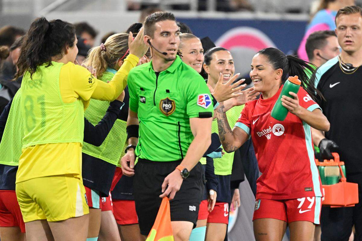 Kansas City Current midfielder Debinha (99) is congratulated after scoring during the first half against the San Diego Wave FC at Snapdragon Stadium on April 12, 2025.