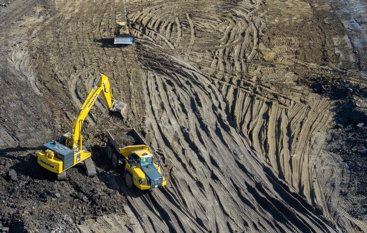Heavy equipment works on the site of a proposed supersize data center on Bly Road in eastern Independence on Friday, Feb. 13, 2026. Nearby residents oppose the planned 400-acre, $6.6 billion AI facility. 