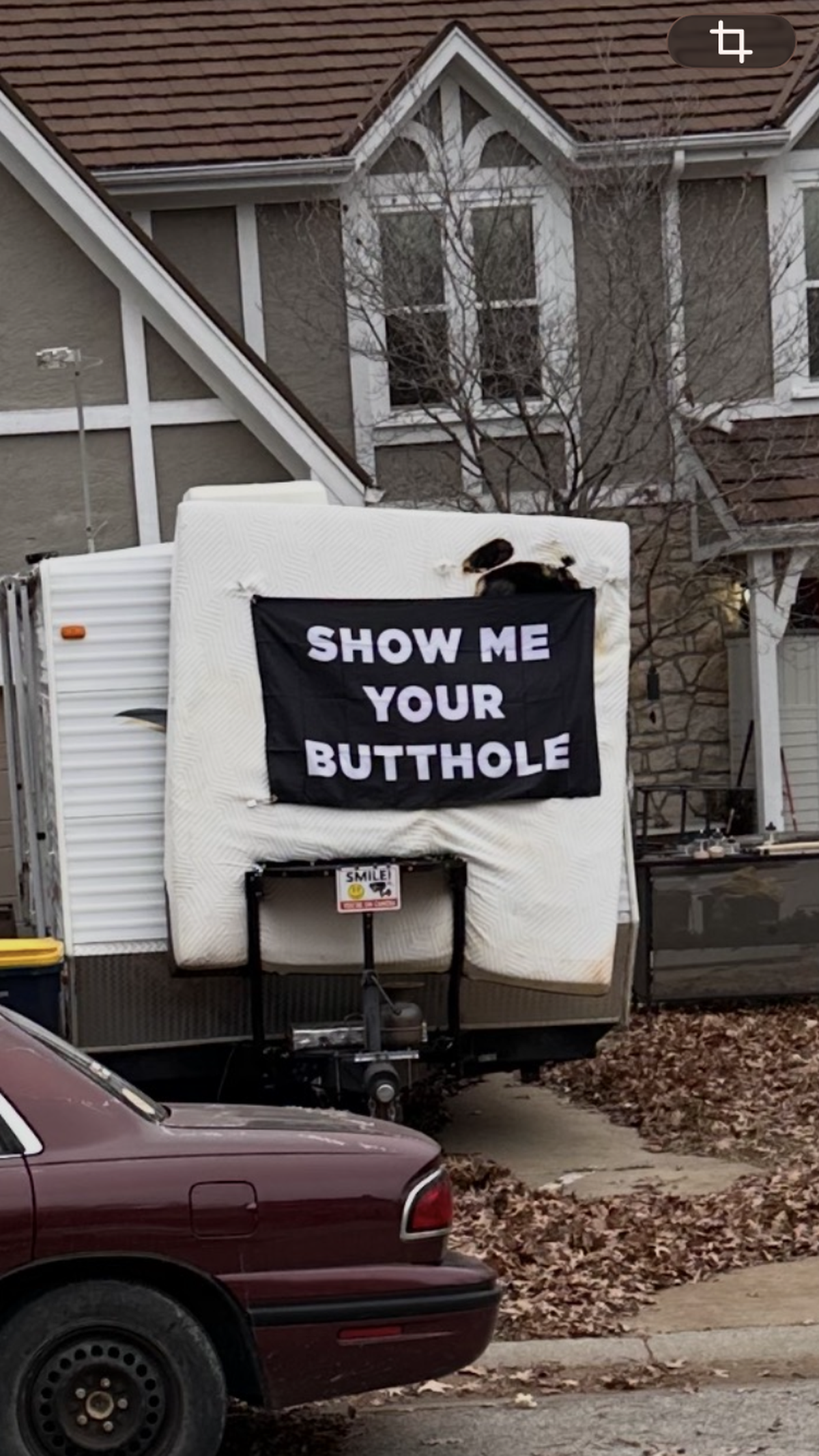 The second of two banners that Jeffrey Traviss King, 42, of Kansas City draped on the back of an R.V. in his driveway in defiance of his neighbors along Northeast 78th Street in Kansas City.
