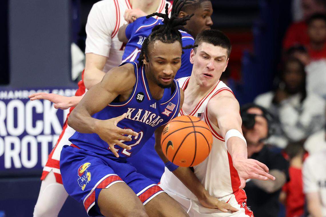 Ivan Kharchenkov #8 of the Arizona Wildcats strips the ball from Darryn Peterson #22 of the Kansas Jayhawks during the first half at McKale Center at ALKEME Arena on February 28, 2026 in Tucson, Arizona.
