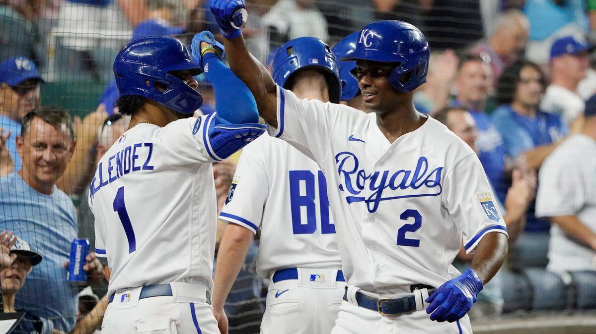Michael A. Taylor, right, gets a welcome-home at home plate from MJ Melendez after homering for the Royals in the eighth inning of Saturday night’s win against the Tampa Bay Rays at Kauffman Stadium.