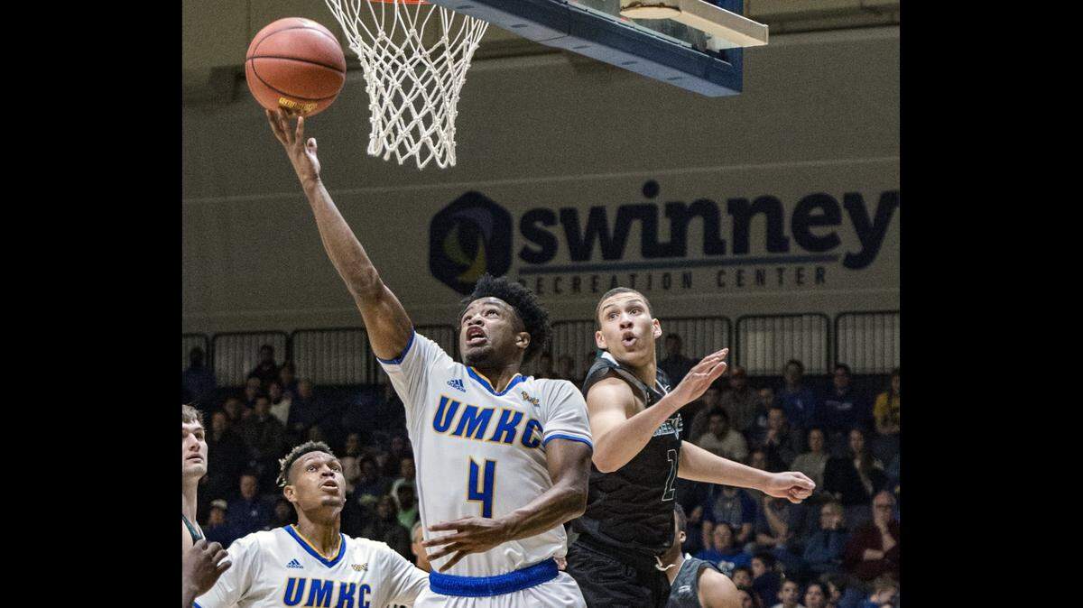 UKMC Kangaroos guard LaVell Boyd (4) scored with a lay up ahead of Green Bay Phoenix forward Kameron Hankerson (21) during the 2017 College Basketball Invitational tournament at the Swinney Recreation Center on the campus of the University of Missouri-Kansas City.