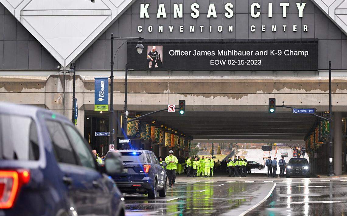 Law enforcement offcers arrived and staged near the Kansas City Convention center as signage paid an ‘End of Watch’ tribute to fallen Kansas City Police Officer James Muhlbauer, 42, and his police K-9, Champ, during a visitation Wednesday, Feb. 22, 2023, at Municipal Auditorium in Kansas City. The officer and K9 were hit and killed when a driver, traveling at a high rate of speed, allegedly ran a red light at Benton Boulevard and E. Truman Road and plowed into the officer’s patrol car on Wednesday, Feb. 15, 2023.