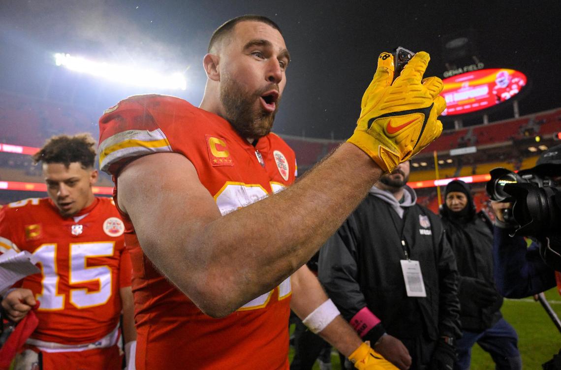 Chiefs tight end Travis Kelce yells into a cell phone as the team celebrated a win over Jacksonville in the Divisional Round of the playoffs on Saturday, Jan. 212023, at GEHA Field at Arrowhead Stadium. Chiefs defeated Jaguars, 27-20.