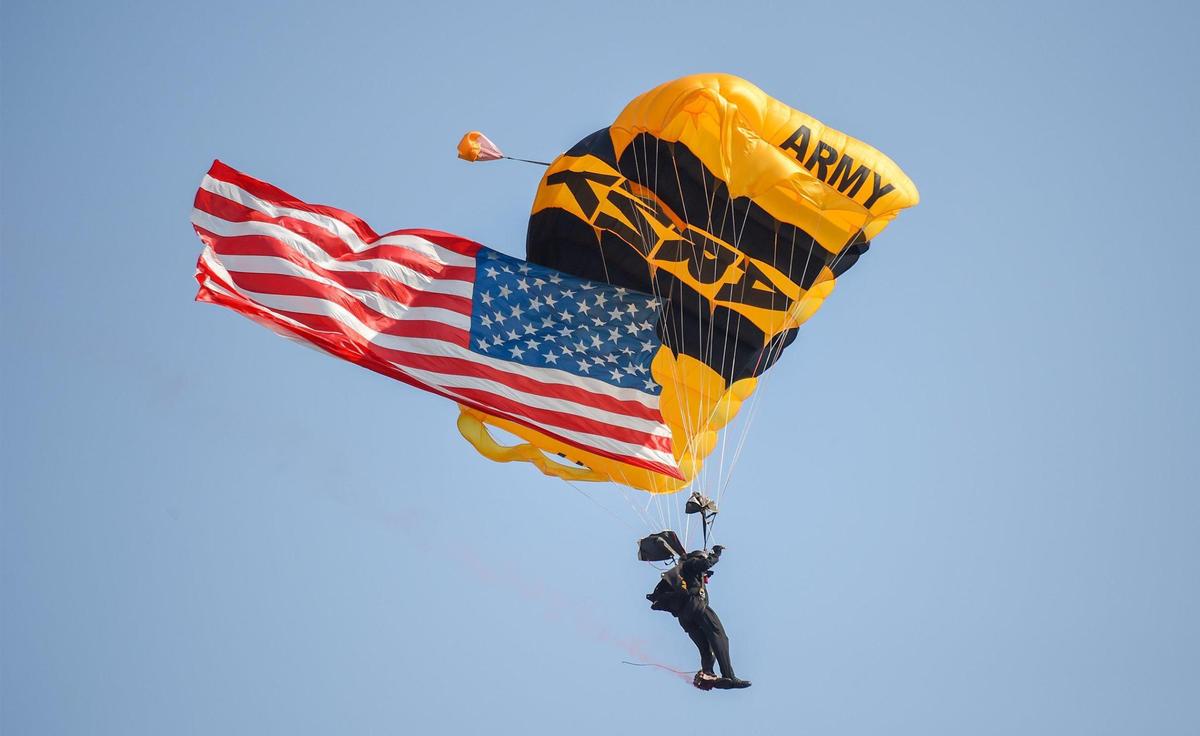 A member of the U.S Army’s Golden Knights Parachuted in the American flag to open at the KC Air Show on Saturday, July 3, 2021, at the New Century AirCenter in Gardner, Kansas.