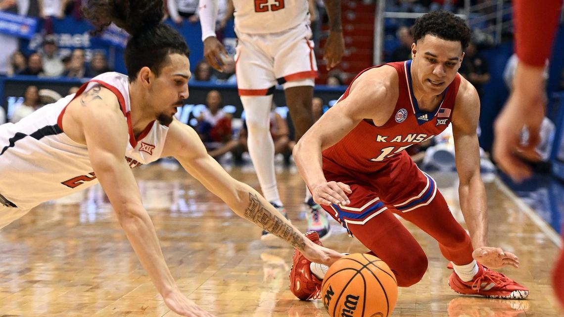 KU’s Kevin McCullar dives for a loose ball during the first half of a Big 12 Conference game at Allen Fieldhouse on Feb. 28, 2023. The Jayhawks defeated Texas Tech to clinch a Big 12 title share.