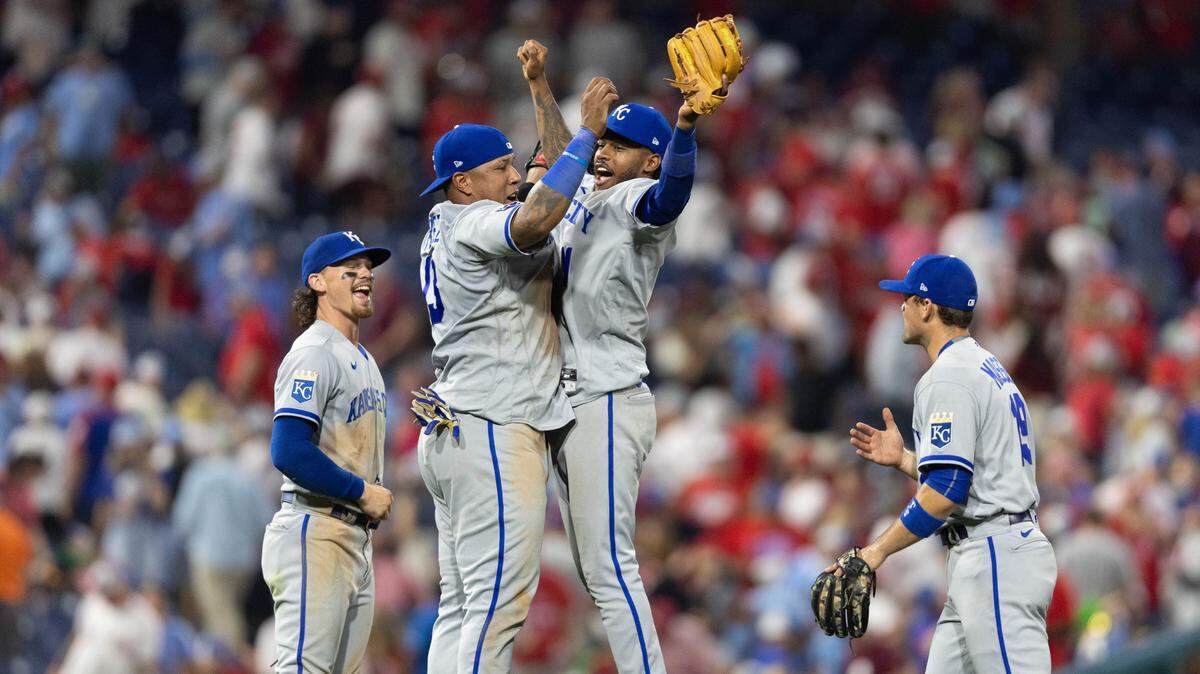 Kansas City Royals catcher Salvador Perez (13) and third baseman Maikel Garcia (11) celebrate a victory against the Philadelphia Phillies at Citizens Bank Park on August 4, 2023.