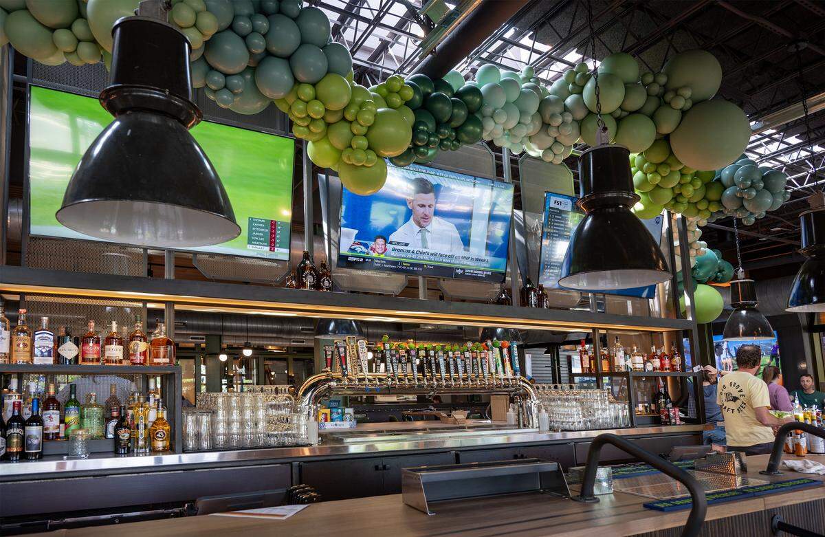 A bar stands at Big Grove Brewery in Prairie Village on Thursday, May 14, 2026. The 12,000-square-foot taproom and restaurant, located in the former Macy's building at 7060 Mission Rd., features an extensive selection of craft beers and is scheduled to officially open on May 21.