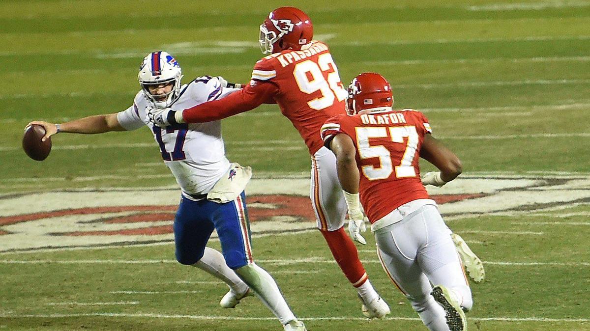 Kansas City Chiefs defensive end Tanoh Kpassagnon (17) and defensive end Alex Okafor sack Buffalo quarterback Josh Allen (17) during the fourth-quarter of the AFC Championship Game Sunday, Jan. 24, 2021, at Arrowhead Stadium in Kansas City. The Chiefs defeated the Bills, 38-24, to head to the Super Bowl.
