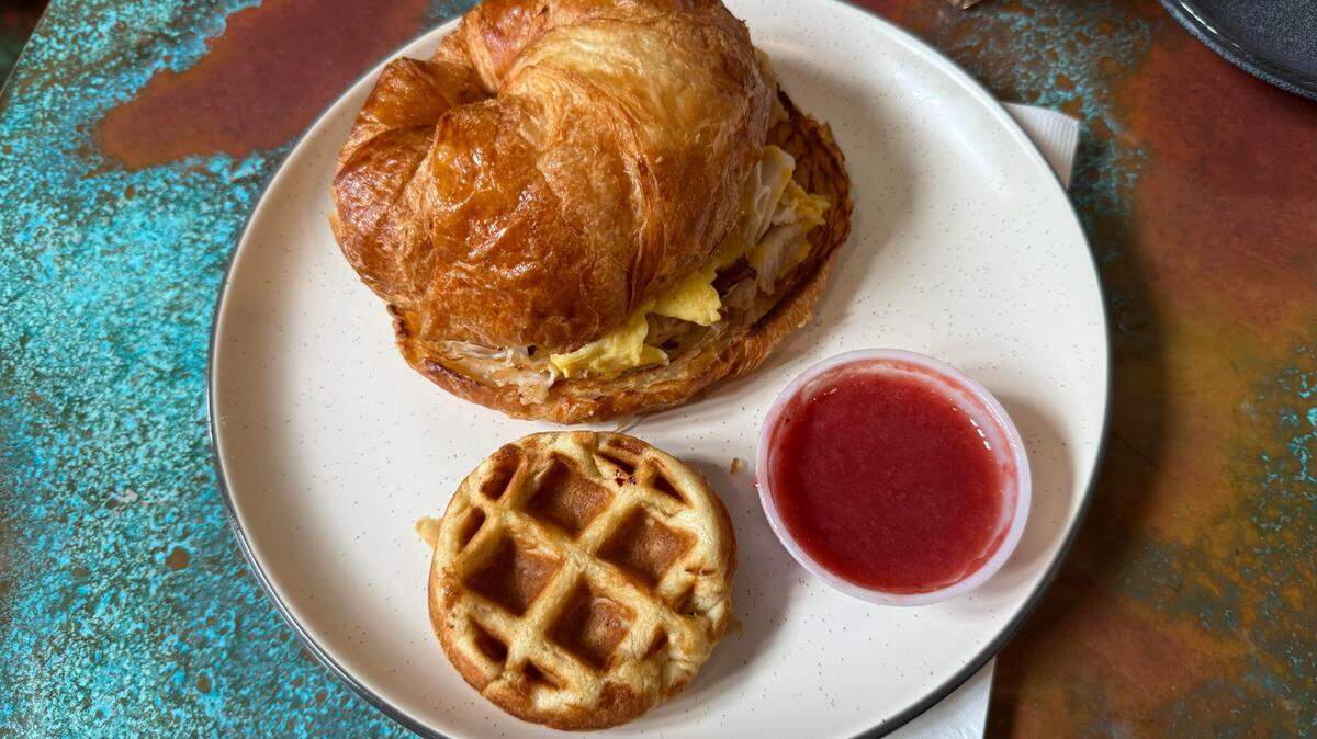 The restaurant offers breakfast sandwiches, mini waffles, spiked coffee and more.