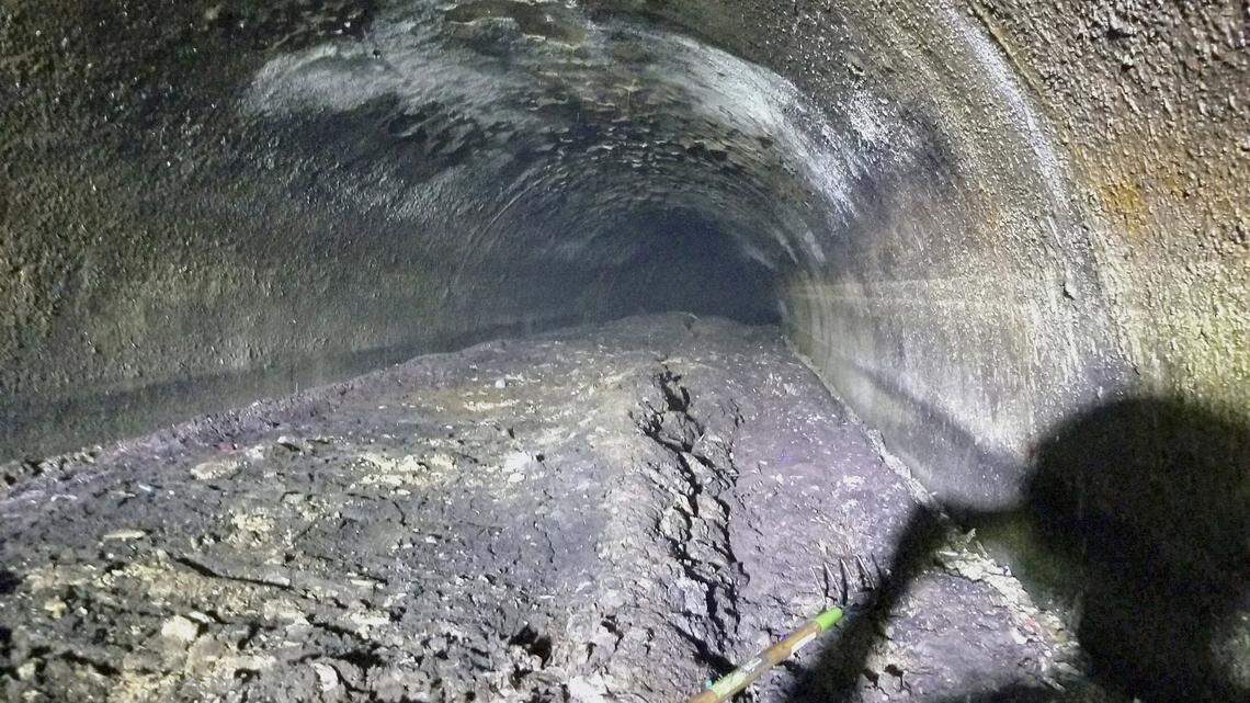 This Sept. 6, 2018, photo provided by the Macomb County Public Works Office shows a large fatberg in a sewer line in Clinton Township, Michigan. The Macomb County Public Works Office says workers cleared the 11-foot-diameter pipe that was partially clogged by the collection of oils, grease, fat and solid items such as baby wipes.