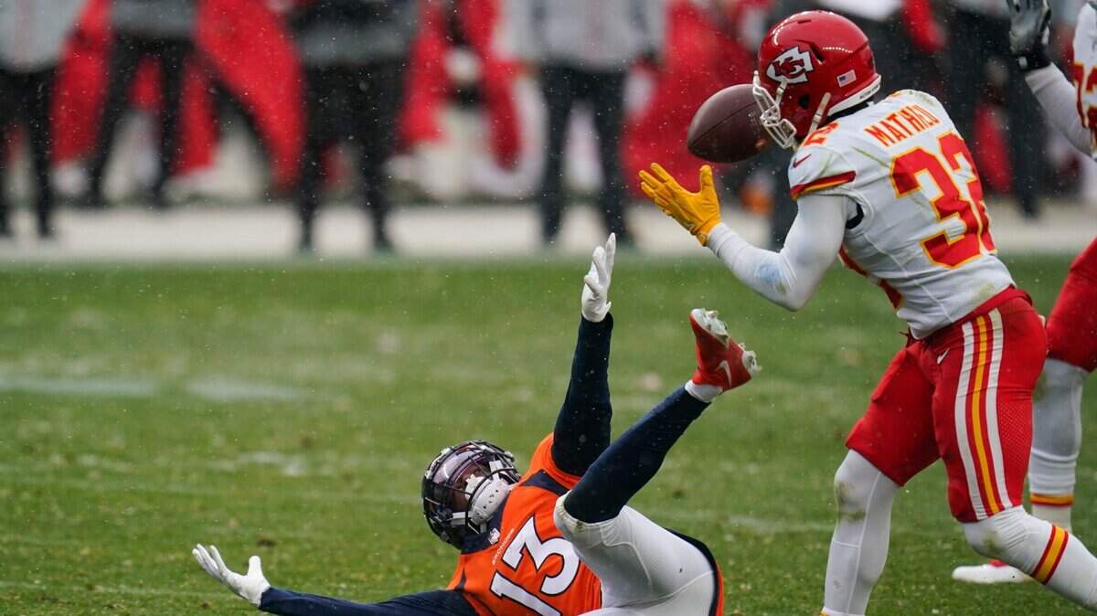 Chiefs safety Tyrann Mathieu, right, intercepts a pass intended for Denver Broncos receiver K.J. Hamler during the second half of Sunday’s game.
