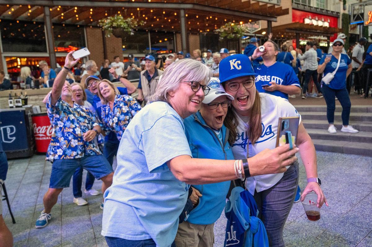 Royals fans capture the moment at the Kansas City Power & Light District as the Royals defeated the Baltimore Orioles, 2-1, to capture the Wild Card series on Wednesday, October 2, 2024, in Baltimore. The Royals advance to the ALDS and will face the Yankees Saturday in New York.