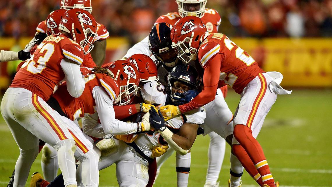 The Chiefs defense swarms Denver Broncos running back Javonte Williams in the third quarter of the Kansas City Chiefs game against the Denver Broncos at GEHA Field at Arrowhead Stadium Sunday, Dec. 5, 2021. The Chiefs defeated the Broncos 22-9.