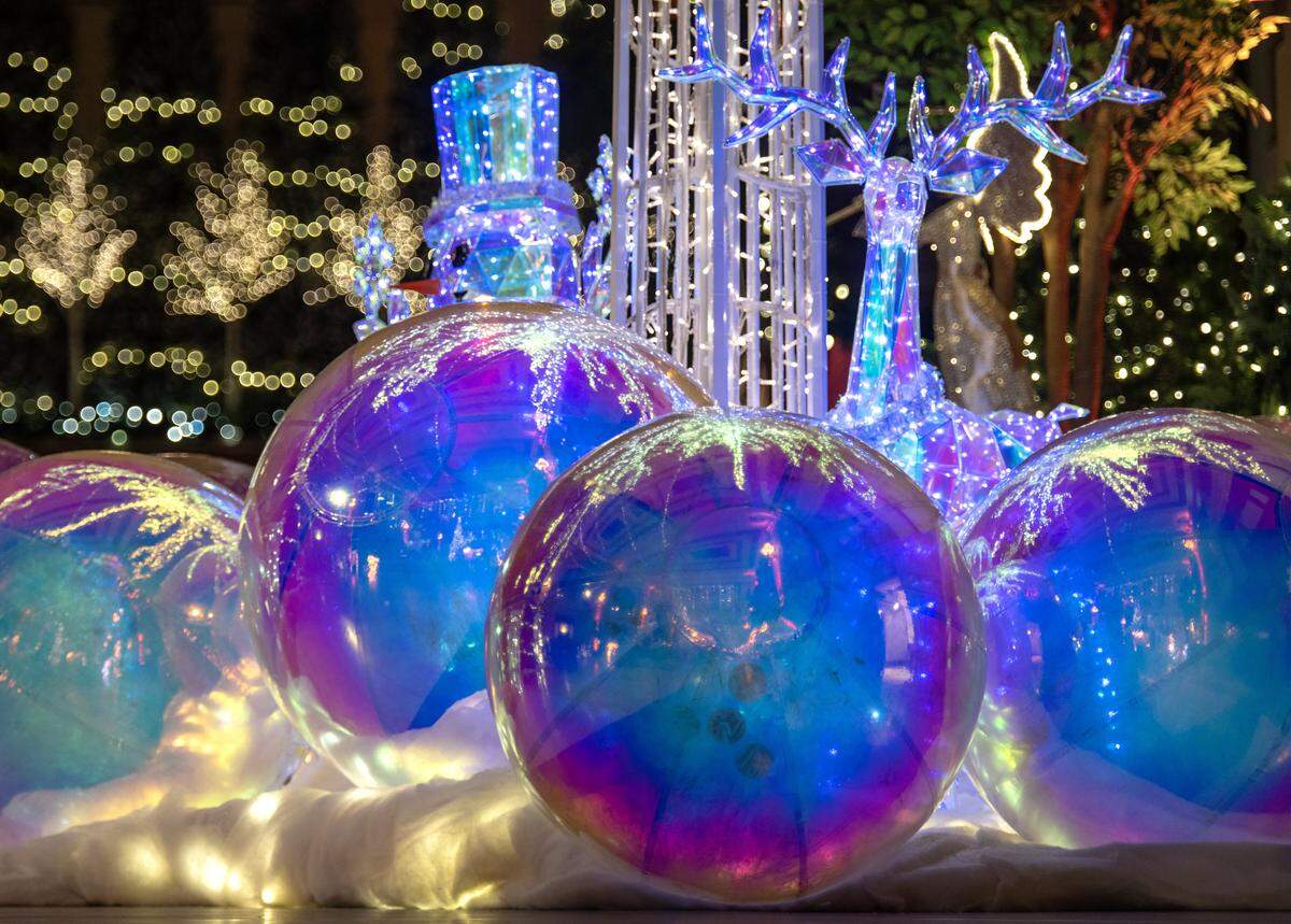 Iridescent decor surrounds the 20 foot tall enchant tree at “Holiday Reflections” at Union Station on Thursday, November 20, 2025, in Kansas City. The exhibit opens Friday, November 21 and runs through January 4, 2026.