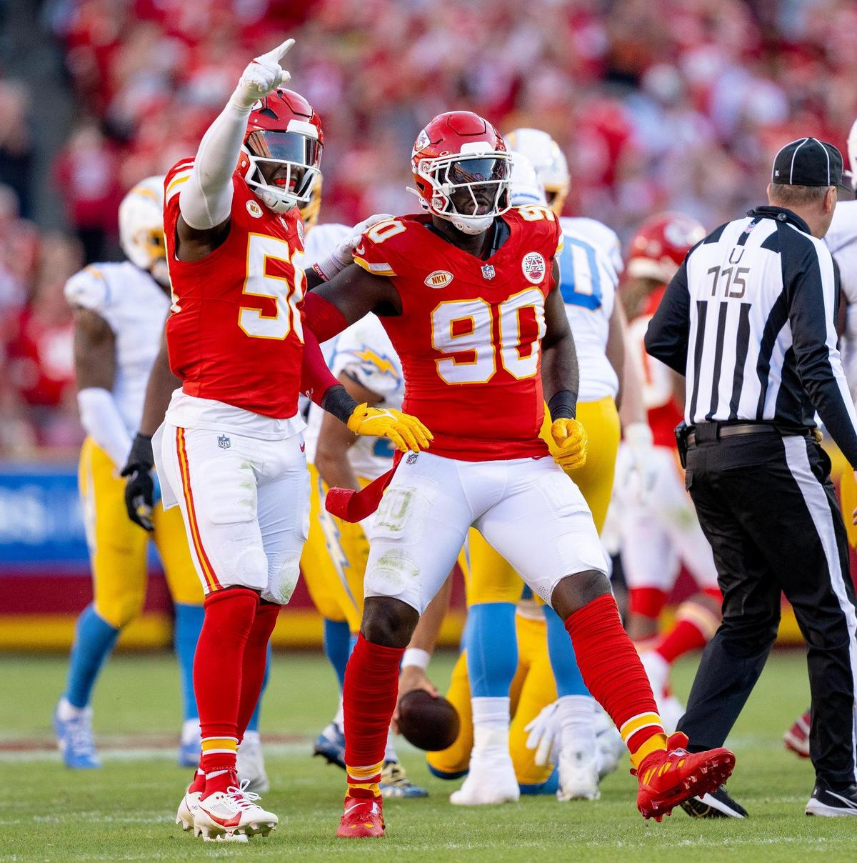 Kansas City Chiefs defensive end Charles Omenihu (90) celebrates a sack with linebacker Willie Gay (50) during an NFL football game against the Los Angeles Chargers at GEHA Field at Arrowhead Stadium on Sunday, Oct. 22, 2023, in Kansas City.