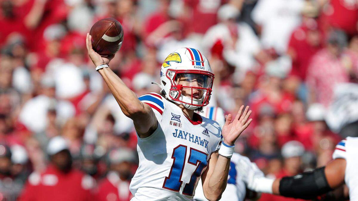 Kansas quarterback Jason Bean throws a pass against Oklahoma during the first half Saturday, Oct. 15, 2022, in Norman, Okla.