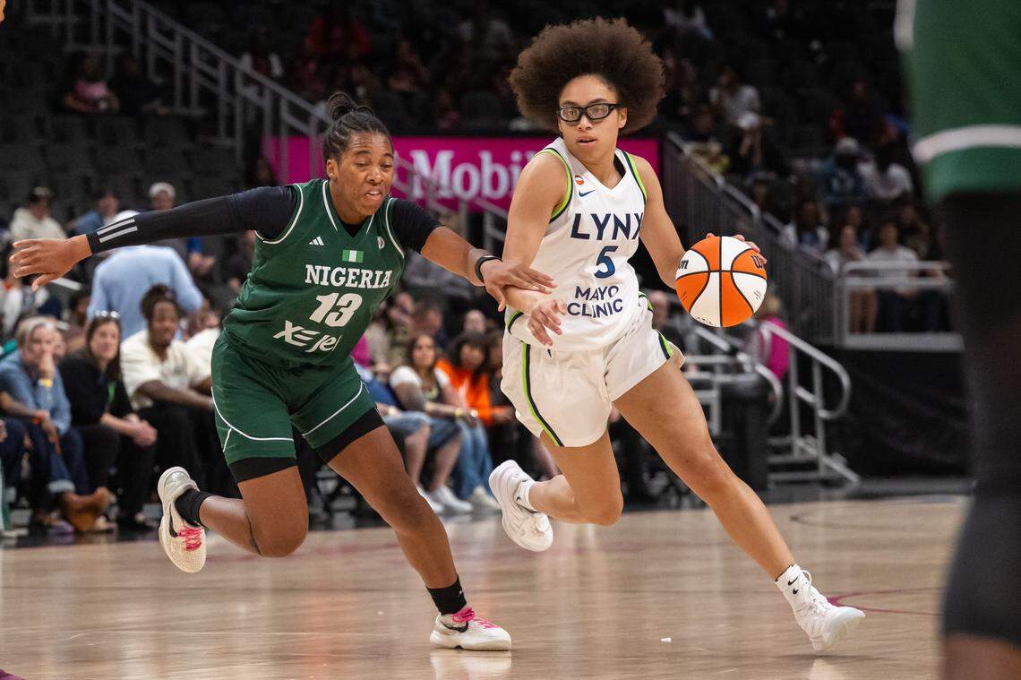 Minnesota Lynx guard Olivia Miles dribbles past a Nigerian defender in the first half of a WNBA preseason game on Monday, April 27, 2026, at T-Mobile Center.