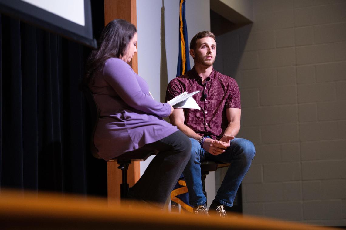 Taylor Webb, right, a senior at Kansas State University, speaks to a room of parents and teenagers at Woodland Spring Middle School about why he started vaping and how he quit after the two-year habit began ruling his life. Ali Seeling, a registered nurse and parent, is leading anti-vaping efforts in the Spring Hill school district and invited Webb to share his story.