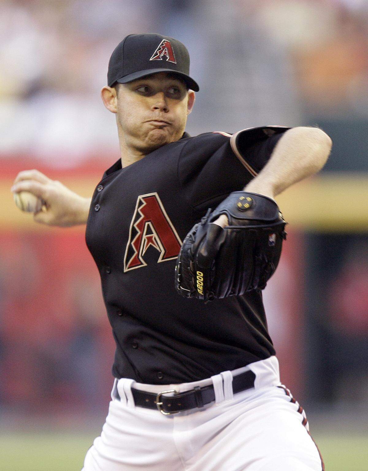Arizona Diamondbacks’ Ian Kennedy winds up to deliver a pitch against the Philadelphia Phillies in the first inning of a baseball game Saturday, April 24, 2010, in Phoenix. (AP Photo/Paul Connors)