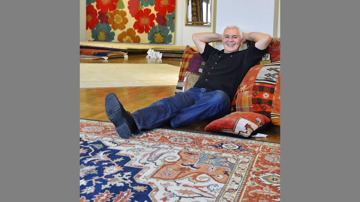 Darrel Wingo, owner of the Knotty Rug, is shown in this 2013 photo when the company opened a store on the Country Club Plaza.