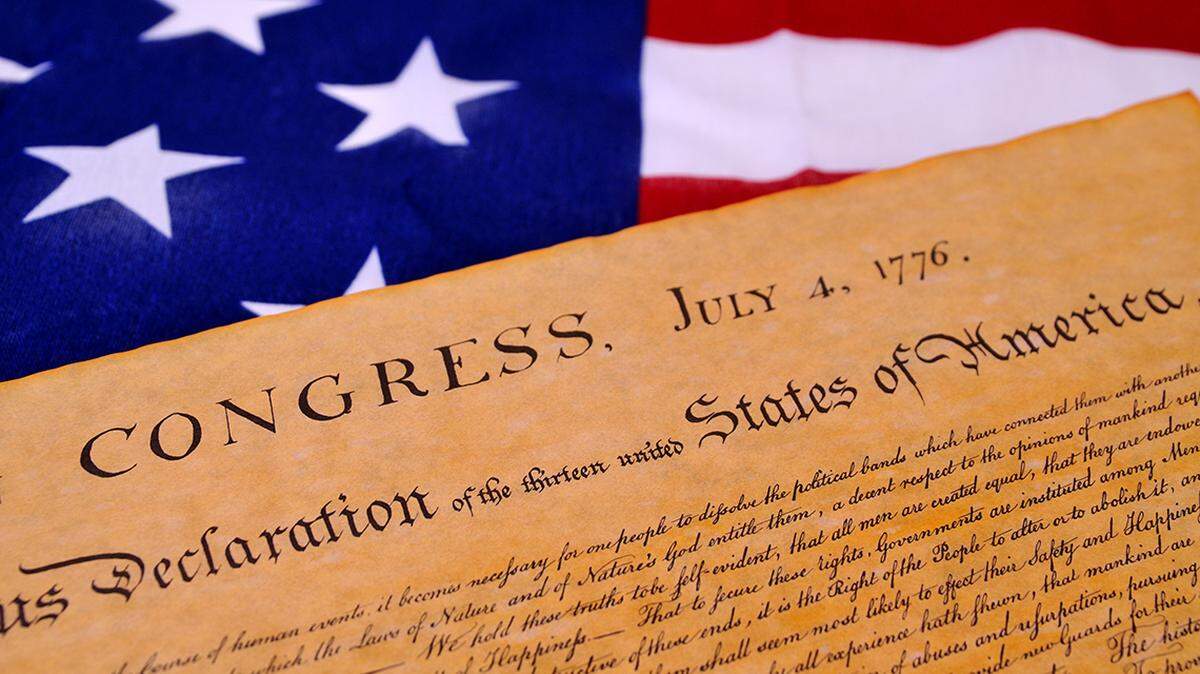 Declaration of Independence with United States flag background