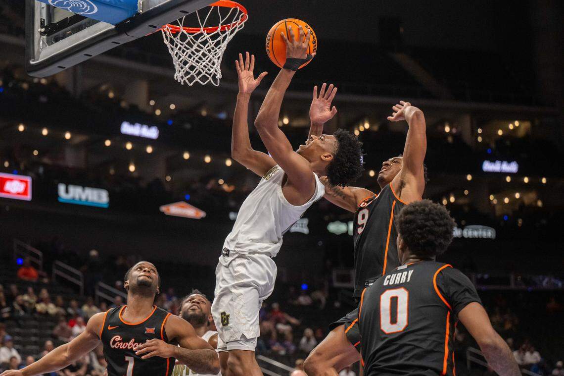 Colorado Buffaloes guard Isaiah Johnson (2) attempts a layup in the second half of the Colorado Buffaloes first round game vs. the Oklahoma State Cowboys in the Big 12 Men's Basketball Tournament, on Tuesday, March 10, 2026, at T-Mobile Center.