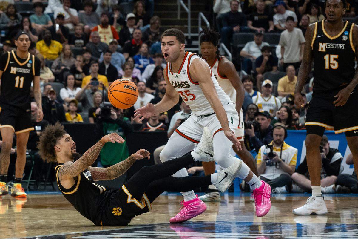 Missouri Tigers guard Jayden Stone (17) passes the ball from the ground in the first half of the Tigers first-round NCAA Tournament matchup vs. the Miami Hurricanes at Enterprise Center in St. Louis on Friday, March 20, 2026.