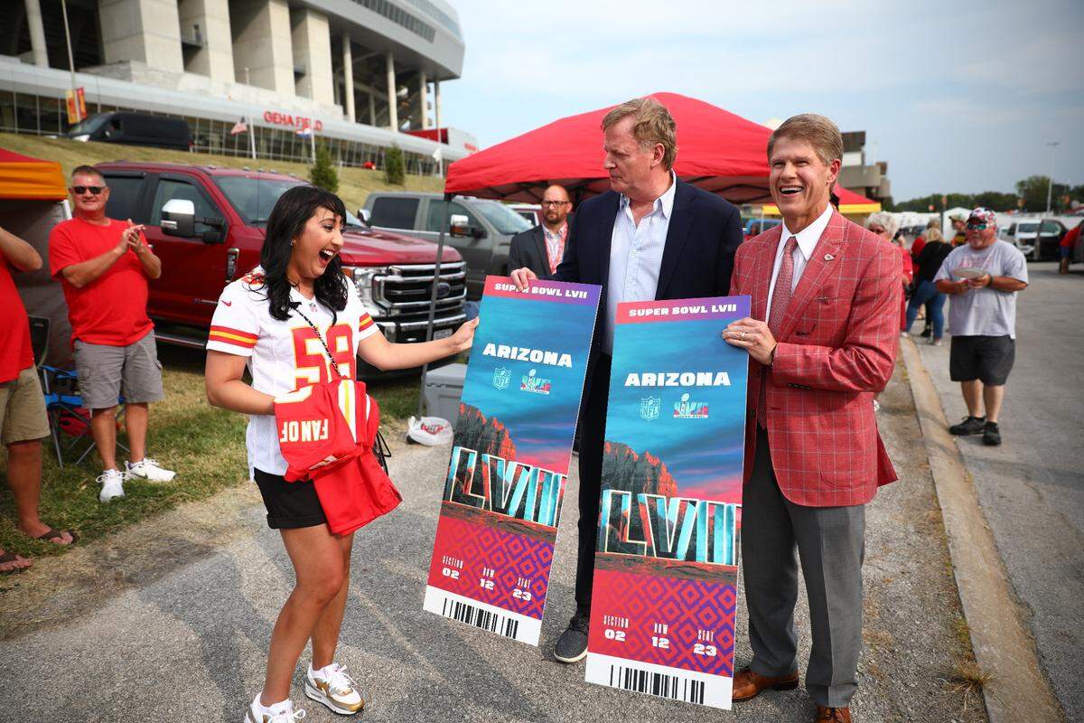NFL Commissioner Roger Goodell, center, and Chiefs CEO and chairman Clark Hunt, right, surprising Dr. Amy Patel with Super Bowl tickets in 2022.