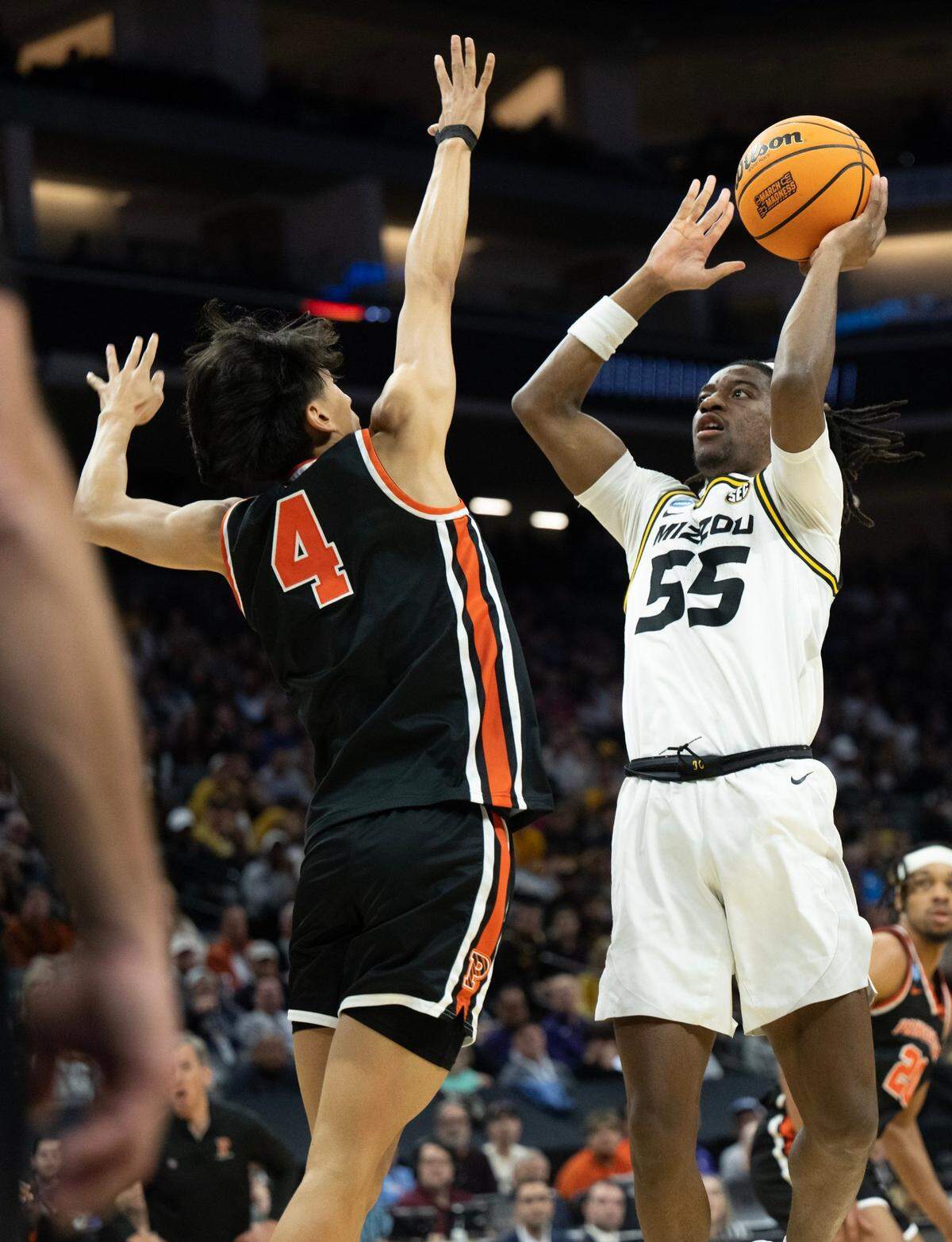Missouri Tigers guard Sean East II (55) shoots over Princeton Tigers guard Xaivian Lee (4) during their second-round game in the NCAA Tournament at Golden 1 Center in Sacramento, Saturday, March 18, 2023.