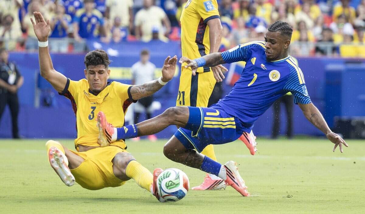 Ecuador defender Piero Hincapié (3) challenges Curaçao midfielder Juninho Bacuna (7) for the ball during a FIFA World Cup group-stage soccer match at Kansas City (Arrowhead) Stadium in Kansas City on Saturday, June 20, 2026.