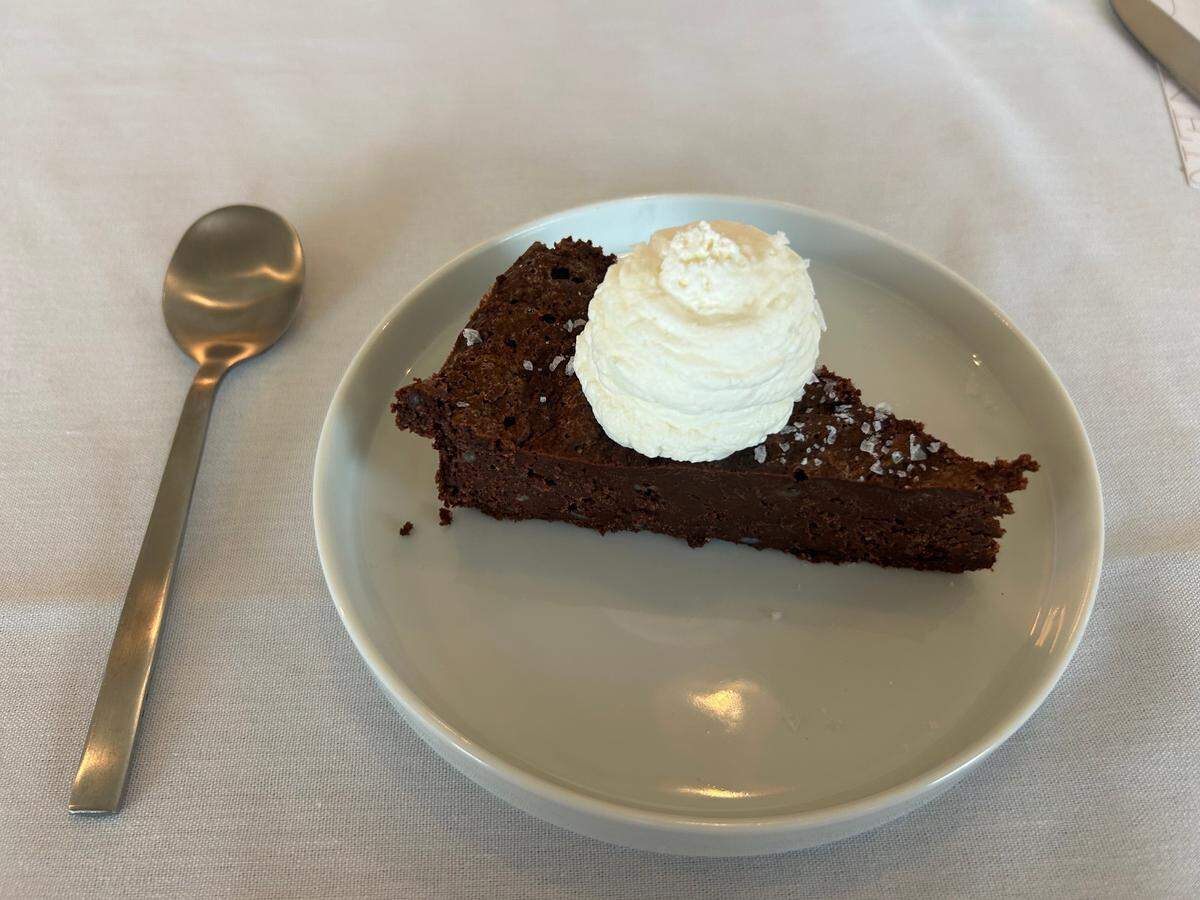 A flourless chocolate cake is one of several desserts on Cru’s menu.