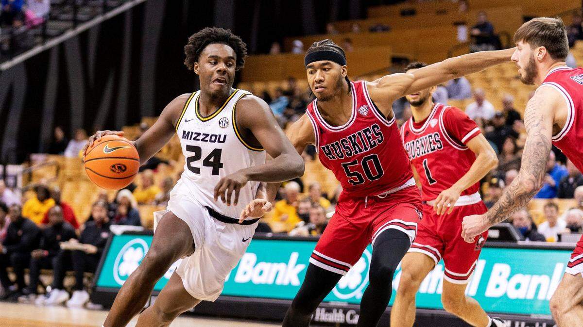 Missouri’s Kobe Brown, left, drives past Northern Illinois’ Anthony Crump, right, during the second half of an NCAA college basketball game, Thursday, Nov. 18, 2021, in Columbia, Mo. Missouri won 54-37.(AP Photo/L.G. Patterson)