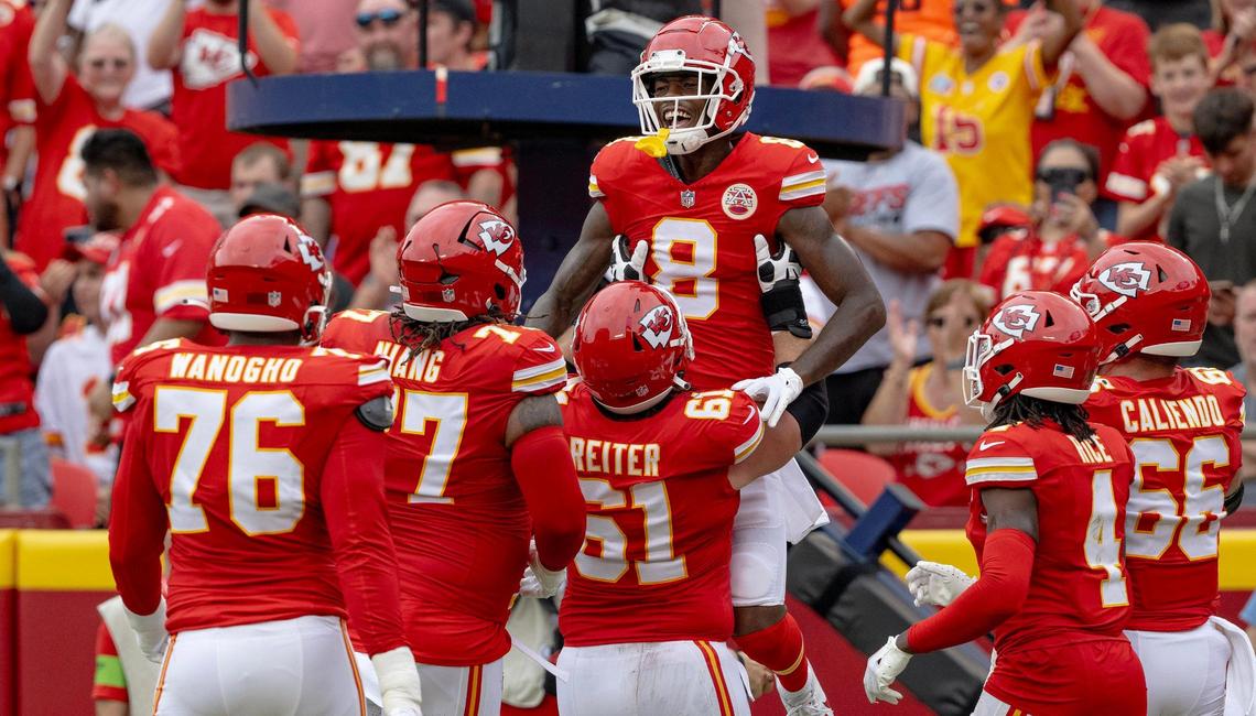 Kansas City Chiefs wide receiver Justyn Ross (8) celebrates a touchdown reception with center Austin Reiter (61) during an NFL preseason football game against the Cleveland Browns on Saturday, Aug. 26, 2023, in Kansas City.