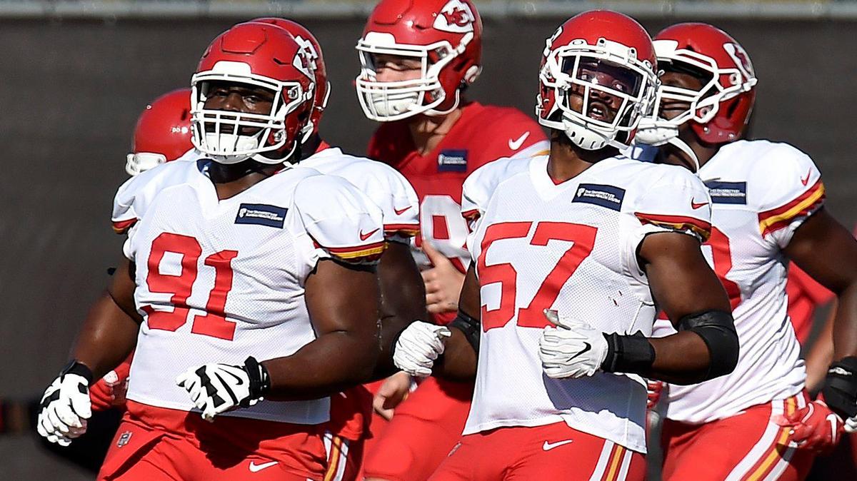 Defensive tackle Derrick Nnadi (91) and defensive end Breeland Speaks (57) warm up during the Kansas City Chiefs training camp at their training facility Thursday, Aug. 20, 2020.