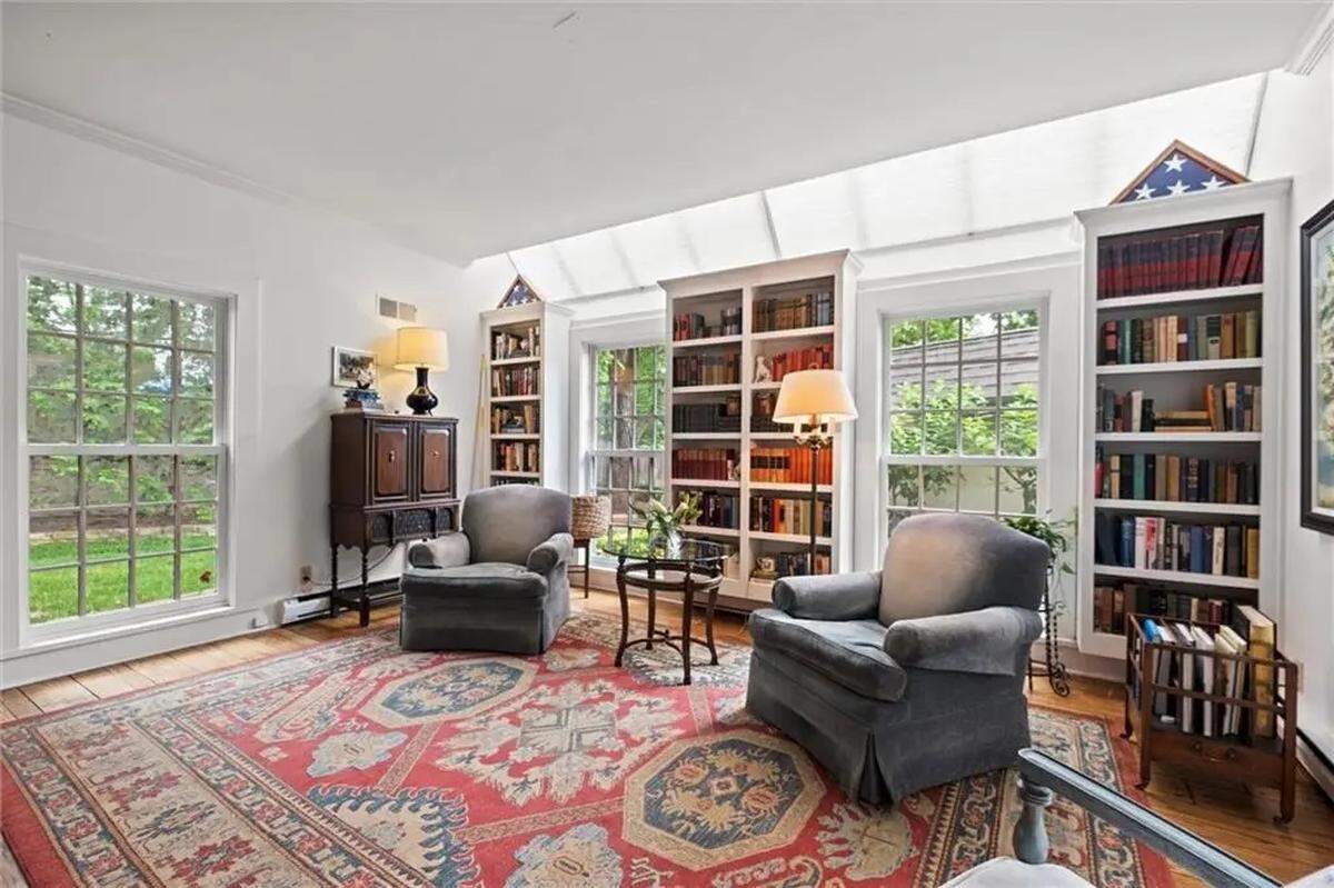 Large windows illuminate the sitting room at Kansas City’s 1234 W. 58th St., located near Ward Parkway and Mission Hills.