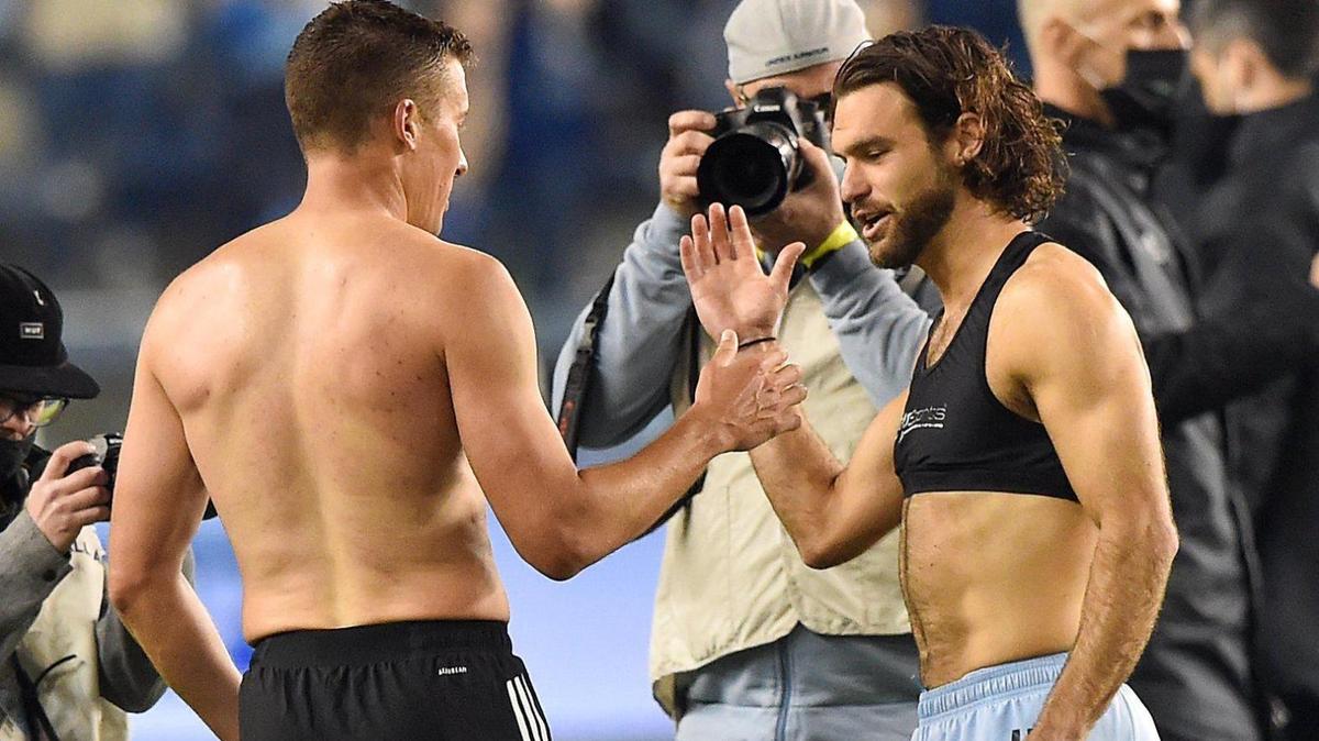 Now playing for Austin FC, Matt Besler, left, and former Sporting Kansas City defender Graham Zusi exchanged kits after Sunday’s match at Children’s Mercy Park.