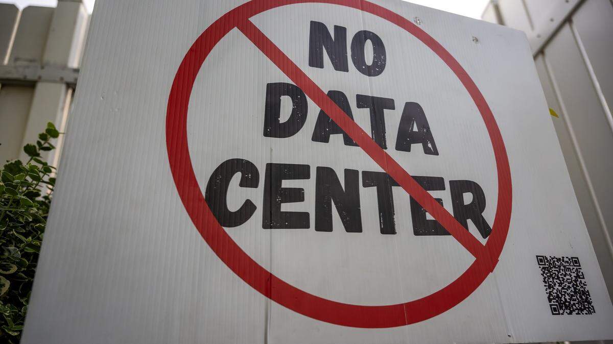 A "No Data Center" sign is displayed outside a town hall meeting at The Rhapsody on Tuesday, June 2, 2026, in Independence. Community members gathered to discuss opposition to the proposed Nebius data center project.