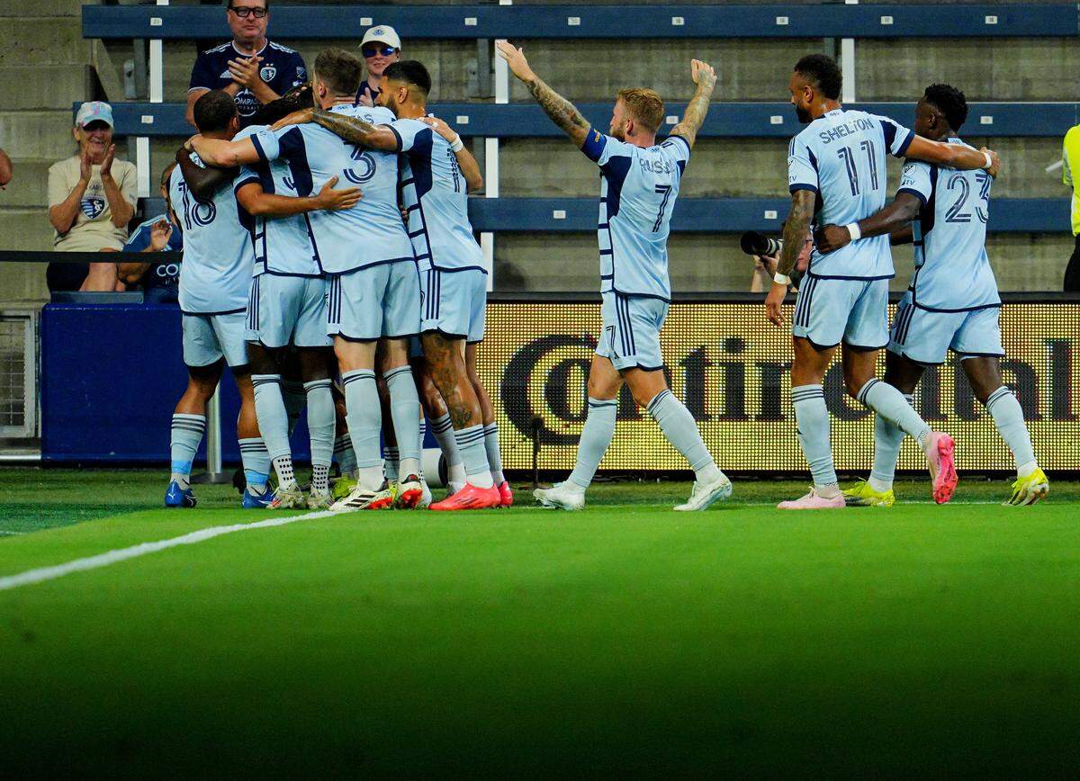 Sporting Kansas City forward Alan Pulido (9) celebrates with teammates after scoring a goal during the first half against the Colorado Rapids at Children’s Mercy Park on Sept. 18, 2024.