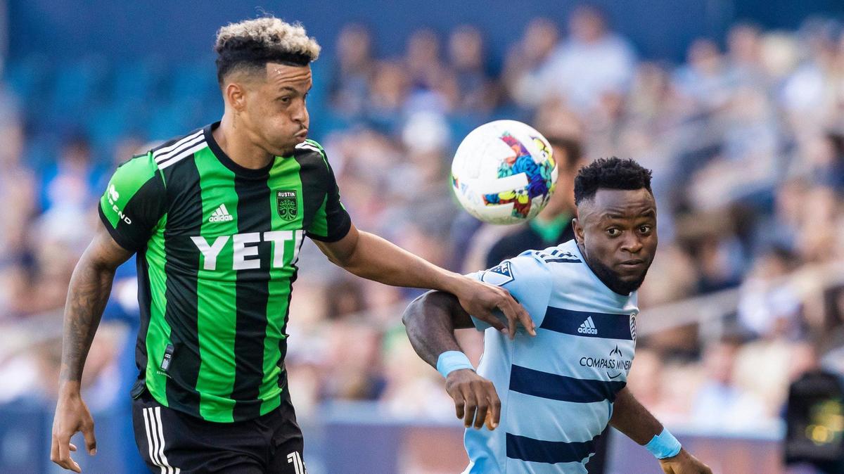 Sporting Kansas City forward William Agada, right, battles Austin FC defender Julio Cascante for the ball during Saturday’s MLS match at at Children’s Mercy Park in Kansas City, Kansas.