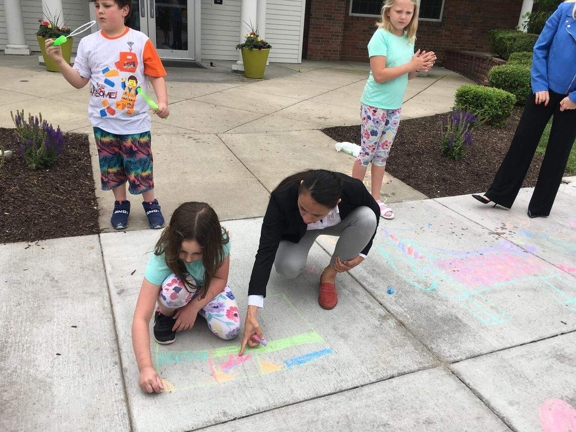 U.S. Rep. Sharice Davids interacts with some of the residents of the KidsTLC inpatient treatment program during a visit Wednesday.